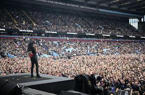 Member of US rock band Anthrax, Joey Belladonna performs for the crowd as a support act, during British rock band Black Sabbath's "Back to The Beginning" concert, Ozzy Osbourne's final ever gig as Black Sabbath's frontman at Villa Park in Birmingham, central England on July 5, 2025. Osbourne, who revealed in 2020 that he has Parkinson's disease, will join Tony Iommi, Geezer Butler and Bill Ward for the all-day "Back To The Beginning" show in Birmingham, central England, where the heavy metal giants formed in 1968. (Photo by Andy Buchanan / AFP) (Photo by ANDY BUCHANAN/AFP via Getty Images)          