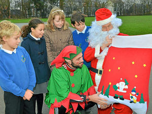 Supporting image for story: Santa and his helpers drop in to Telford school