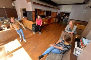 In the old bar at the Rock & Fountain are, from left, volunteer and service user Julie Webster, outreach worker Cherry Teearu, deputy manager Rose Greenslade and chair of trustees Emily Bell