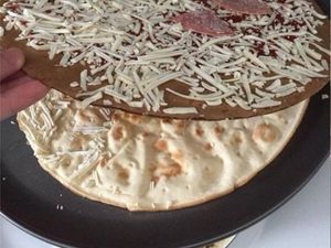 Supporting image for story: This poor customer found his pizza had cardboard between its topping and crust