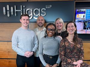 PJ Ellis with staff at Higgs LLP in Brierley Hill
