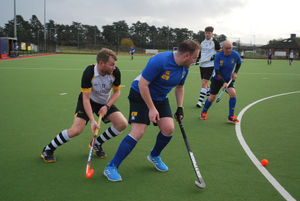 Pershore attack and Stourport's defence cover the ball