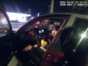 Supporting image for story: Sacked police officer charged after shooting teenager eating a burger in his car