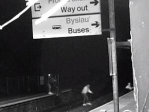 Supporting image for story: Shocking CCTV shows people crossing railway lines and narrowly avoiding being hit by trains