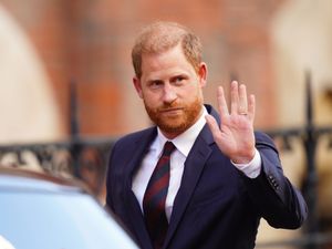 The Duke of Sussex waves as he leaves the High Court in London