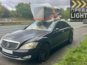 Supporting image for story: 'Chill Out!' Staffordshire road traffic cops stop driver on M6 who strapped fridge-freezer on car roof