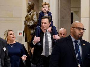 Elon Musk carries his son X Æ A-Xii on his shoulders