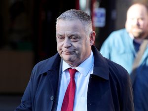 MP Mike Amesbury wearing a navy blue jacket, white shirt and red tie outside Chester Ellesmere Port and Neston Magistrates’ Court