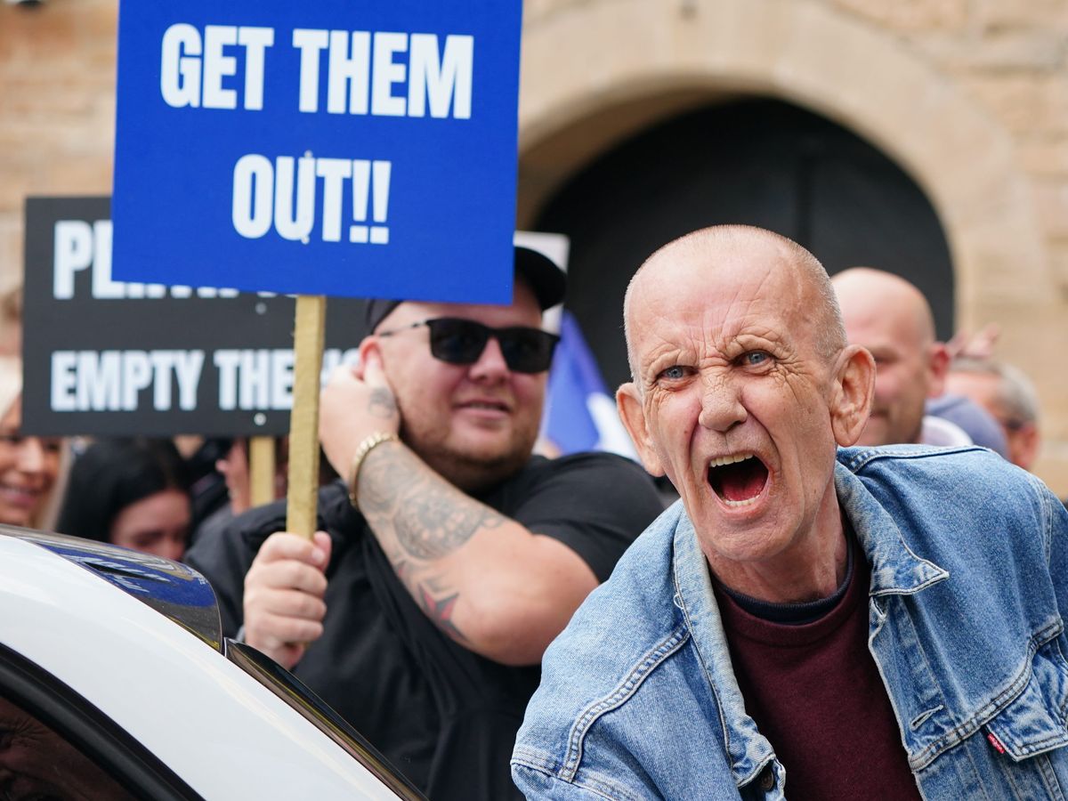 Opposing sides chant and shout outside asylum hotel in Perth