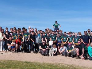 Junior rugby players and their families at the top of The Wrekin. The sponsored walk has raised more than £2,600 so far. 