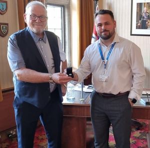 Cllr Andrew Tromans (right) presents a Srebrenica commemorative pin badge to Mayor Pete Lee ahead of the meeting of Dudley Council on June 19. Picture Andrew Tromans free for LDRS use