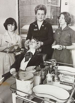 Occupational Health Unit, Pensnett Trading Estate, Brierley Hill. The photograph shows with a patient (from left) Jayne Blackford, Barbara Haywood and Pauline Kendrick in March 1978.
