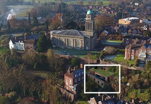An aerial shot shows how the new home would fit into the town landscape