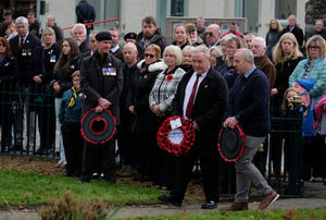 County Councillor Jeremy Pugh and Christian Prynne of Builth Wells Running Club on their way to laying wreaths at the cenotaph. Pic by Andy Compton