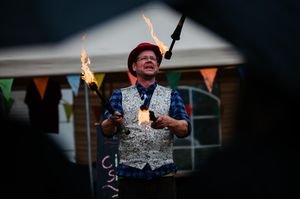 The crowd were impressed with the fire breather's juggling 