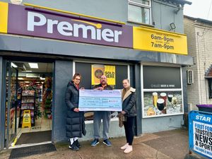 Tina (left), Chloe and Ian with the cheque