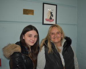 Martin’s mother Julie and daughter Elisha by the plaque and her picture