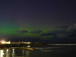 Supporting image for story: Green and pink skies light up the North thanks to aurora borealis