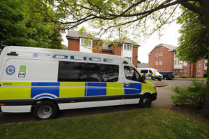 Police vans parked up in Mission Drive where officers have been searching a property