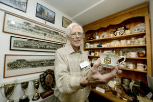 Museum Manager Ian Picton-Robinson with a cup from the Corbet Hotel at the exhibition of Market Drayton through the ages at Market Drayton Museum & Resource Centre, Shropshire Street, Market Drayton
