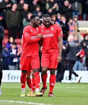Amari Morgan-Smith comforts Nathan Cameron at the final whistle.