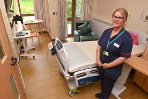 Ward manager Zoe Thomas inside one of the Perry Ward's rooms that are too small and outdated.