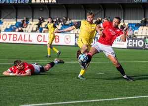 Dudley Town fight to keep visitors Alport clear of goal.  Pic: Liam Pritchard