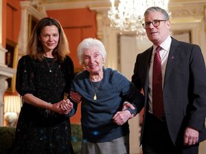 Prime Minister Sir Keir Starmer and his wife Lady Victoria, help Holocaust survivor Renee Salt during a reception