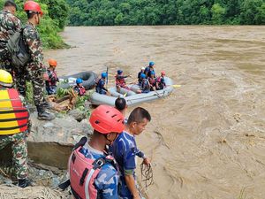 Supporting image for story: Two buses carrying more than 50 people swept into river by landslide in Nepal