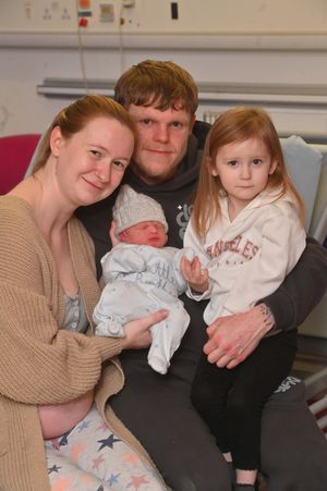 Laura Ball and Connor Jones, of Tividale, with new year baby Hudson Jones, and his sister Maisie, aged three. 