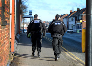 Police make their way down pass the cordon