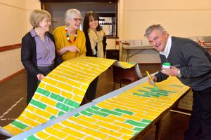 Working on the props is Rob Lee with Michele Rowland-Jones, Sally Williams and Michele Lee