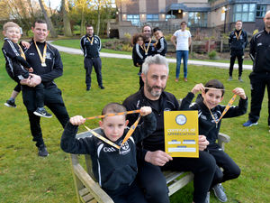 Supporting image for story: Medals all round as club shows community spirit in fundraiser