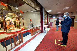 Dahyubhai K Patel uses one of the spaces allocated in the prayer hall at the Shree Krishna temple