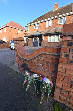 Flowers outside the property where the stabbing occurred on Christmas Day