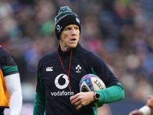 Ireland interim boss Simon Easterby wears a bobble hat and carries a ball