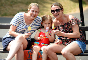 Claire Riley, Maisie Riley, aged 2, and Julie Pilmore enjoy a lolly at Walsall Arboretum