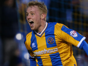 Supporting image for story: Jack Grimmer raises almost £800 for Shrewsbury Food Hub by auctioning two famous Town shirts