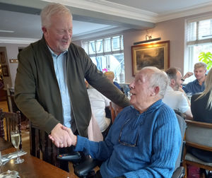Graham shakes hands with Stuart