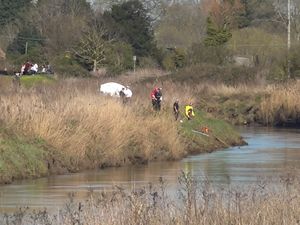 Supporting image for story: Divers recover body of teenage girl from river as search continues for male