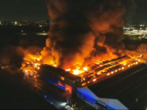 Supporting image for story: Shock photos of Birmingham carpet factory fire show smoke billowing into the sky as residents are urged to keep windows closed