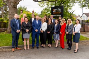 Managing director, Andrew Davies, front centre, with recently promoted colleagues