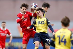 Luke Leahy of Shrewsbury Town and Tyler Goodrham of Oxford United.