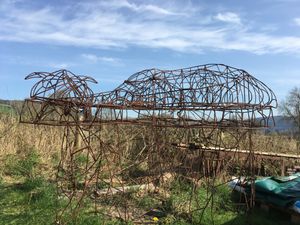 The sleeping dragon's skeletal steel frame has been moved into Pete Smith's workshop for some alterations and work.