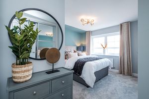 The main bedroom of a Show Home at Poppy Fields