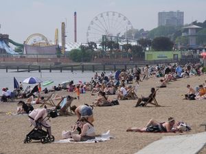 People enjoy the warm weather on the beach at Southend-on-Sea