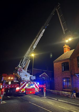 Firefighters used the aerial platform to get above the chimney and spray water down the flue. Picture: Market Drayton Fire Station