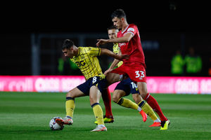 Tom Flanagan of Shrewsbury Town and Cameron Brannagan of Oxford United (AMA)