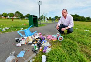 MP Eddie Hughes with rubbish left behind by travellers in Goscote
