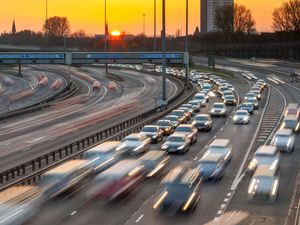 Traffic on a motorway at sunset